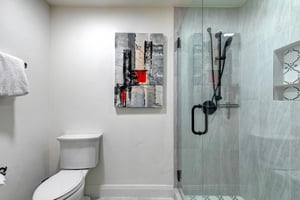 Refresh after your adventures in this sleek bathroom, featuring a spacious walkin shower.