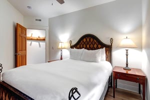 Sink into crisp linens and soft pillows in your serene bedroom, where elegant bedside lighting and a handcrafted headboard create the perfect haven for restful nights.