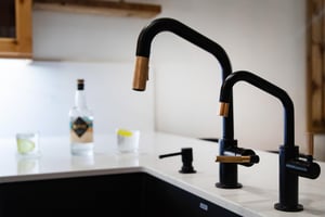 Sleek black and copper fixtures complement your modern kitchen.