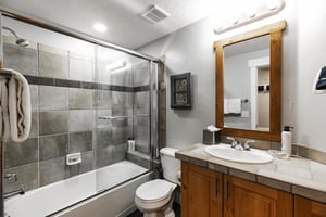Final guest full guest bathroom, tiled countertops and shower