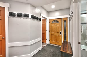 Ski racks and coat rack in the entryway