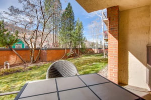 Park Station 113 has a private patio with a sitting area overlooking the trees and mountains beyond.