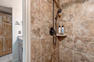 The walkin tiled shower.