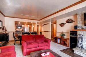 Park Station 139 has a living room with red suede couches.