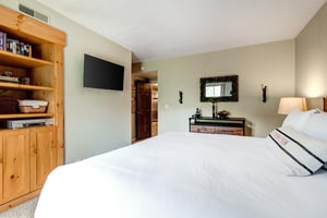 The main suite has a kingsize bed and TV.