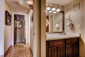 The shared bathroom has a single sink vanity.