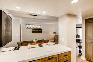 Marbled granite countertops in the kitchen, breakfast bar seating for 3
