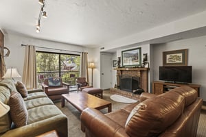 Park Station 121 has a living room with comfortable furnishings and wood burning fireplace.