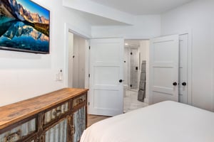 The main suite offers a flat screen TV and an en suite bathroom.