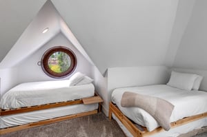 The second bedroom with two twin beds and twin trundles.