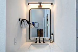 The attached bathroom with single sink vanity.
