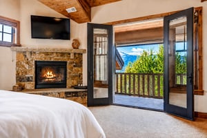 Gorgeous mountain views from the main suite balcony and cozy fireplace.