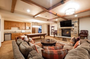 Lower level great room with fireplace and TV
