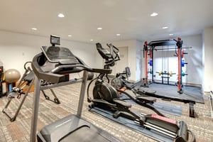 Stay active during your stay in this wellequipped fitness center featuring cardio machines, strength training equipment, and modern amenities for your workout routine.