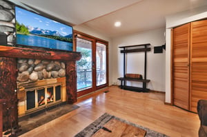 Front room with cabinet hiding the private washerdryer