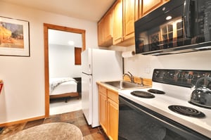 Fully equipped kitchen outside of the bedroom