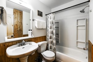 Full ensuite bathroom off the bedroom with showertub combo