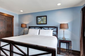 The main suite with a king size bed and comfortable furnishings.