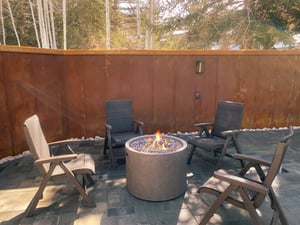 The Lakeside Condos poolside gas firepit with sitting area