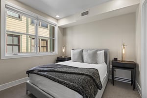 The second bedroom with a queen size bed.