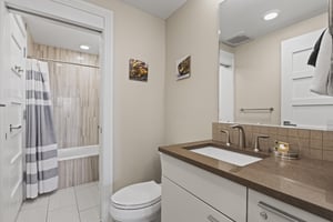 Bathroom two with a bathtub and shower combination.