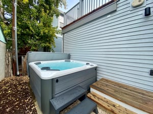 Enjoy your own private, jetted hot tub in the back yard with convenient steps