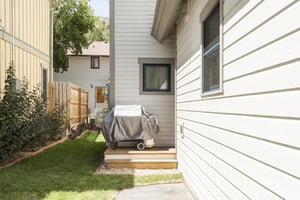 propane grill on the outdoor side patio