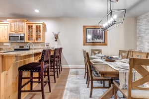Gather around warm wood tones and granite countertops in your spacious kitchen and dining area, perfect for sharing meals and making memories with loved ones.