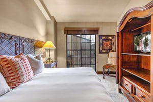 Unwind in your elegant bedroom featuring crisp linens and a king size bed.