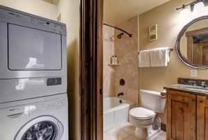 Your private bathroom features a convenient washerdryer combo, granite vanity, and relaxing tubshower combination.