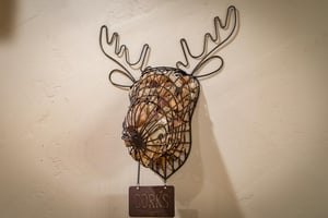 Fun mountain style decor in the kitchen, wire moose to hold wine corks