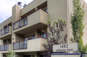 Exterior view of Edelweiss Haus with private balconies and mature landscaping.