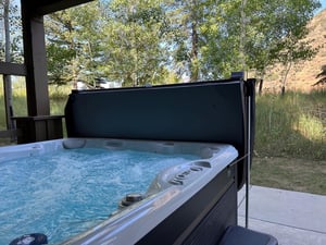 Spacious private jetted hot tub overlooking aspens.