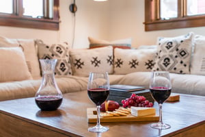 The living room offers a large sectional sofa and coffee table, perfect for entertaining.