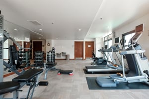 Lowell fitness center, treadmill, elliptical, stationary bike, and Peloton