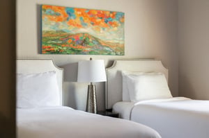 Guest bedroom with two twin beds that can be converted to a king with advance notice.