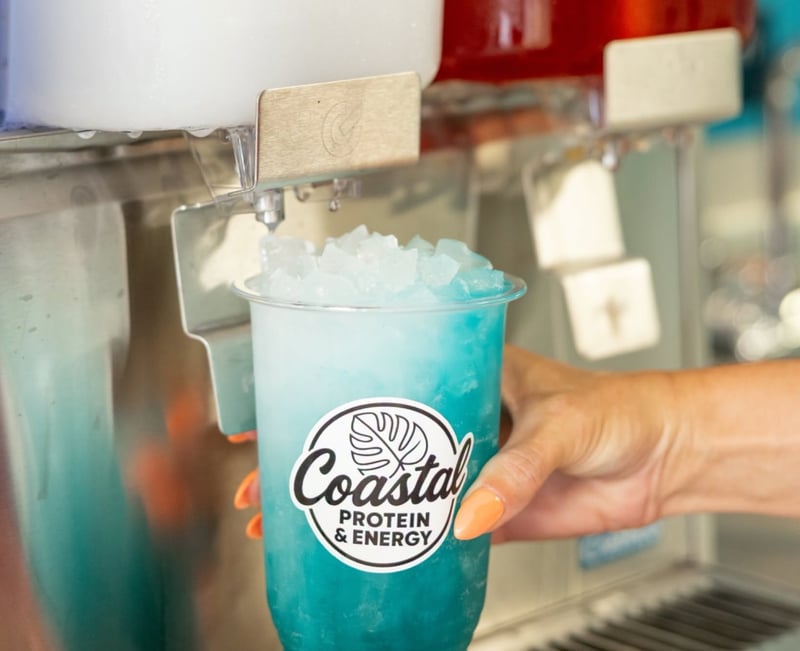2262748 A Hand Holding A Plastic Cup