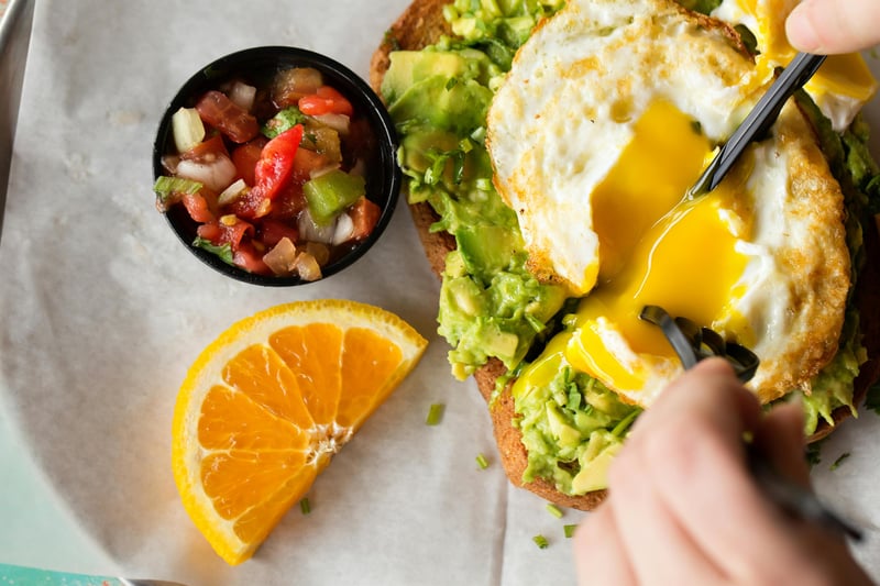 2262750 A Person Eating A Sandwich