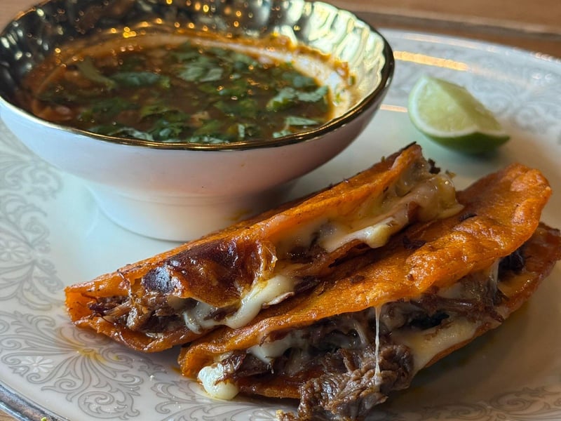 Birria tacos with braised Waygu beef and Oaxaca cheese