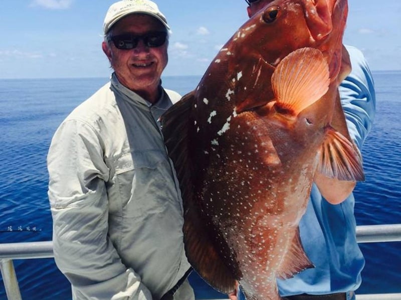 Two anglers with their large catch from a trip with Boss Charters