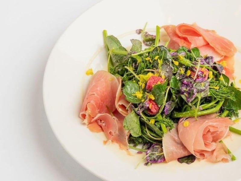 The prosciutto and melon salad with a raspberry orange vinaigrette