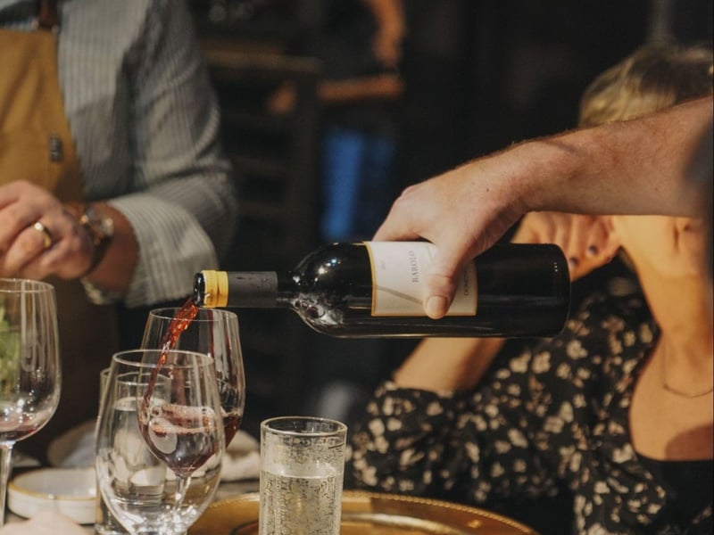 A wine bottle and glass at Roux on 30a in Santa Rosa Beach, Florida
