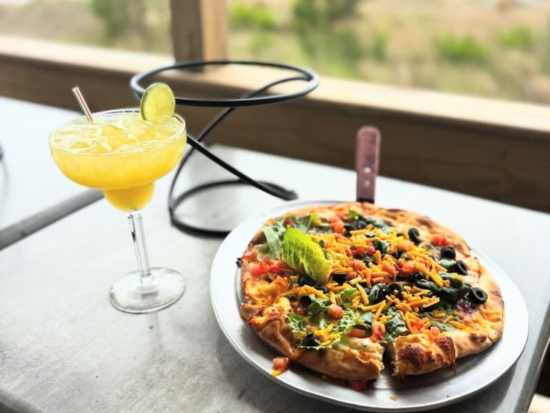 A personal pizza and frozen cocktail