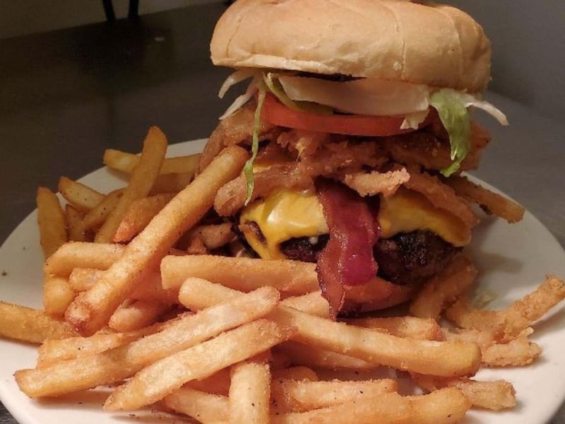 A burger with fries