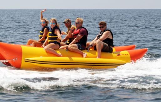 Friends touring the Gulf on a thrilling Banana Boat ride