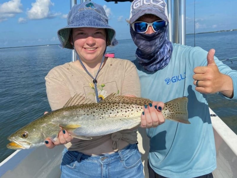 Captain Jack with a guest on the boat