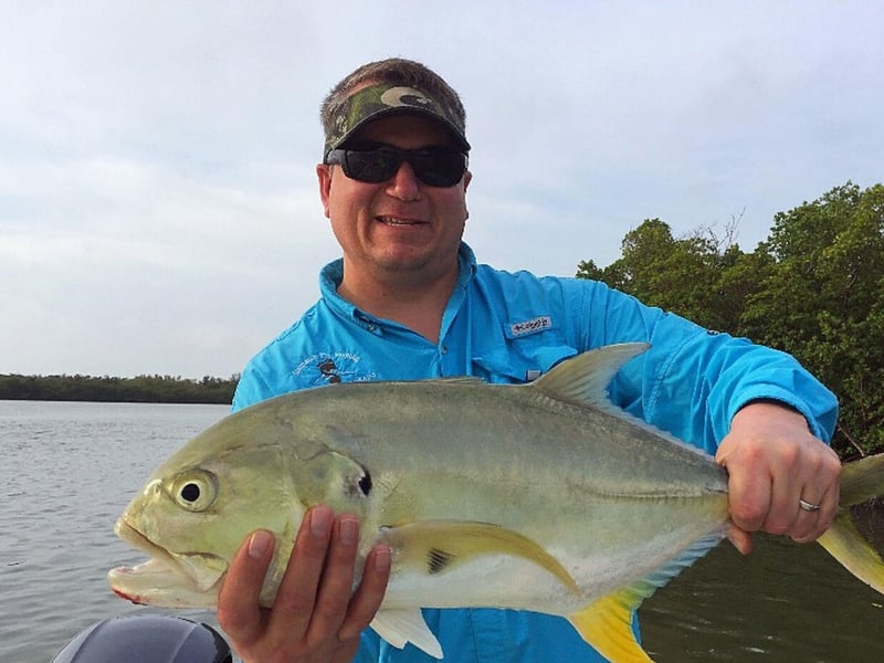 An angler showing off his catch