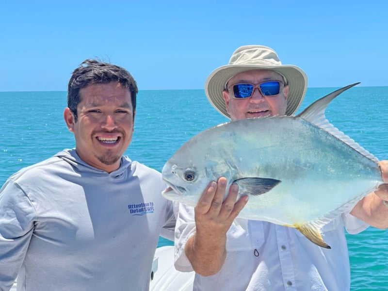 Captain Edwin Estala and an angler with his catch