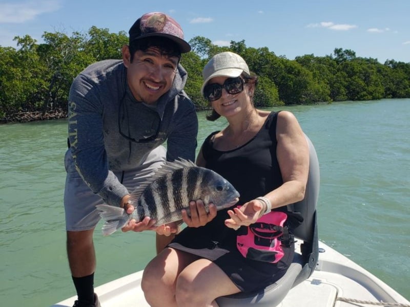 A lady with her catch from Born 2 Boogie