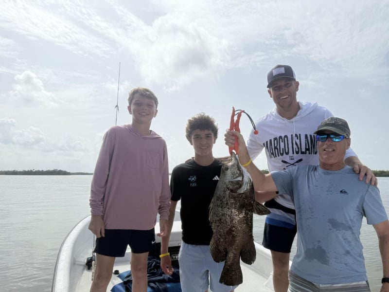A family on the back of Wishin I Was Fishin Charters
